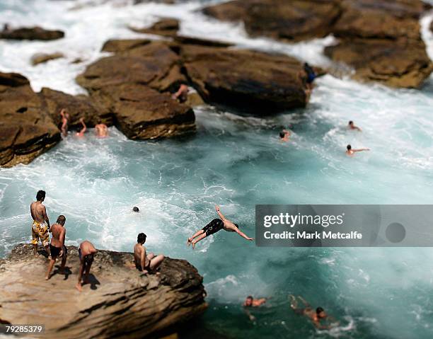 Children play in a rock pool at Coogee beach on January 28, 2008 in Sydney, Australia. Local Sydneysiders took advantage of the nice weather on the...