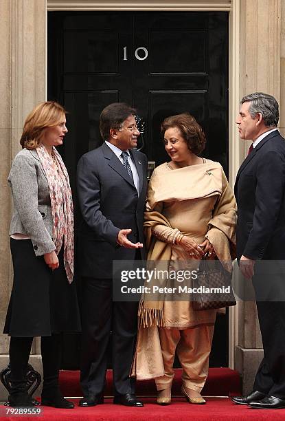 Pakistan's President Pervez Musharraf and his wife Sehba are welcomed in Downing Street by Prime Minister Gordon Brown and his wife Sarah on January...