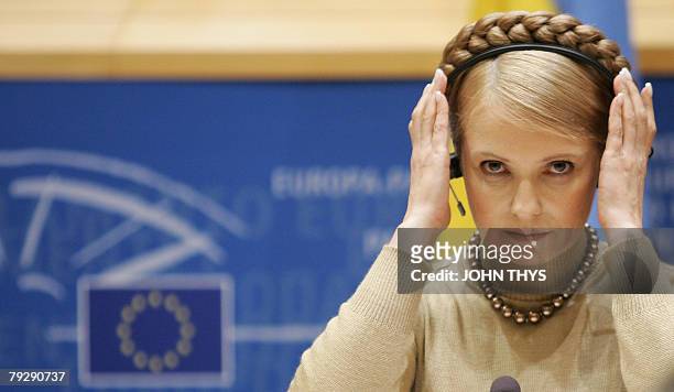 Ukrainian Prime Minister Yulia Tymoschenko adjusts her headset at the EU Parliament in Brussels, 28 January 2008. Tymoshenko denied toay that her...