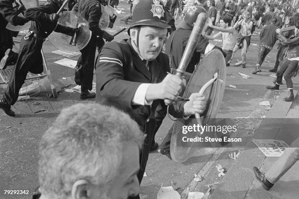 Police and demonstrators clash in Trafalgar Square during rioting, which arose from a demonstration against the Poll Tax, London, 31st March 1990.