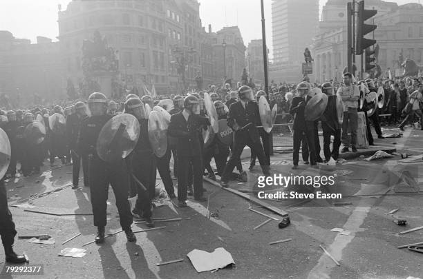 Riot police form a defensive line in Trafalgar Square during rioting, which arose from a demonstration against the Poll Tax, London, 31st March 1990.