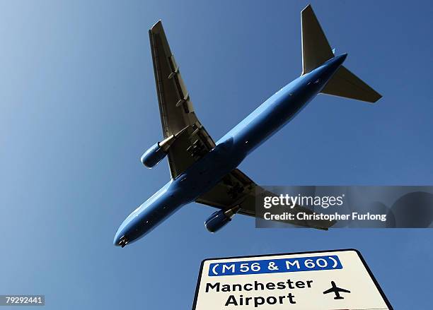 Passenger aircraft landing at Manchester International Airport approaches the runway on 28 January Manchester, England. Baggage handlers at the...