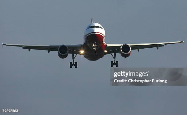 Passenger aircraft landing at Manchester International Airport approaches the runway on 28 January Manchester, England. Baggage handlers at the...