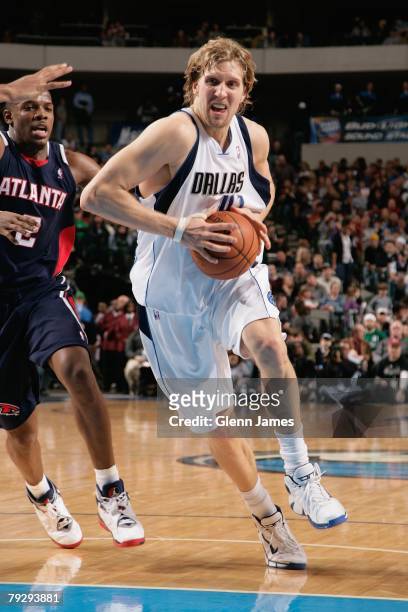 Dirk Nowitzki of the Dallas Mavericks drives to the basket against Joe Johnson of the Atlanta Hawks during the game on December 29, 2007 at American...