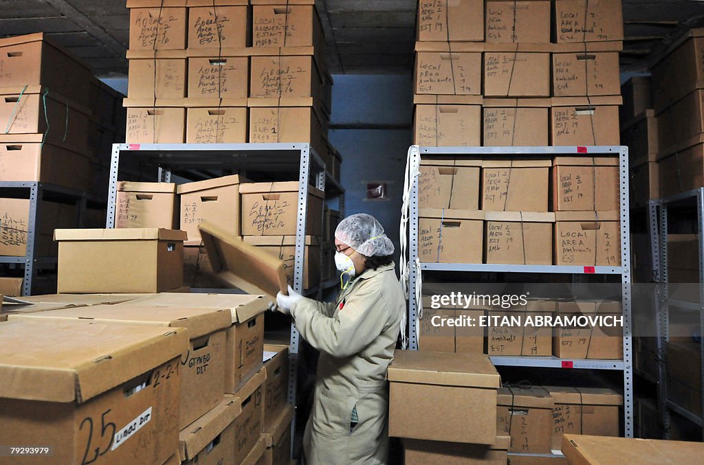 Worker File A worker files documents found at the former National Police Bomb ...