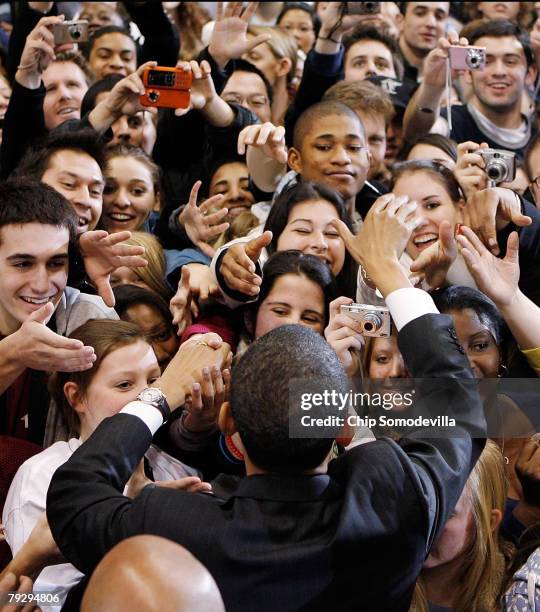 Supporters surge forward to shake hands with Sen. Barack Obama during a rally in the Bender Arena at American University January 28, 2008 in...