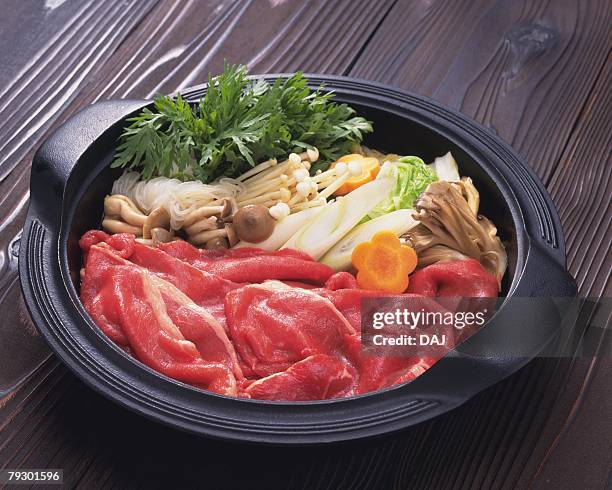 vegetable and beef in pot, preparation for sukiyaki, high angle view - sukiyaki stock-fotos und bilder