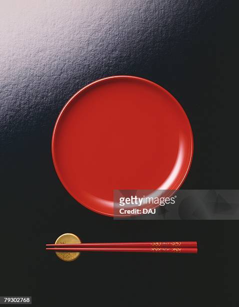 japanese plate and chopsticks on holder, high angle view, black background - 皿　和 ストックフォトと画像