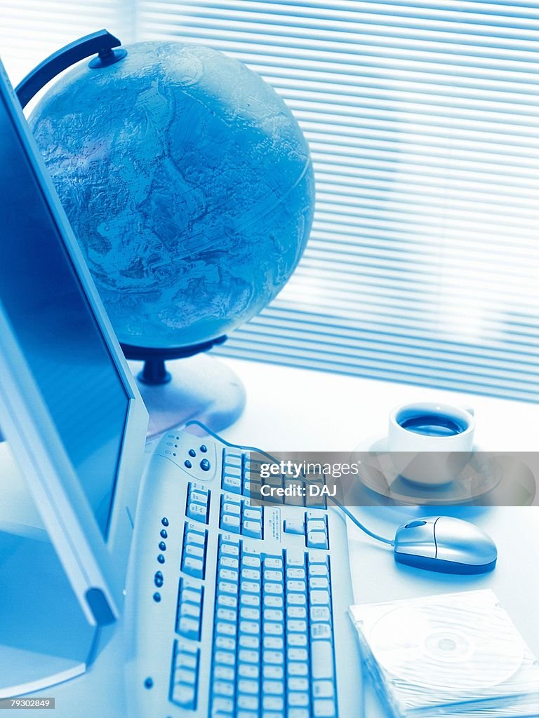 Photography of globe and computer, High Angle View, Toned Image