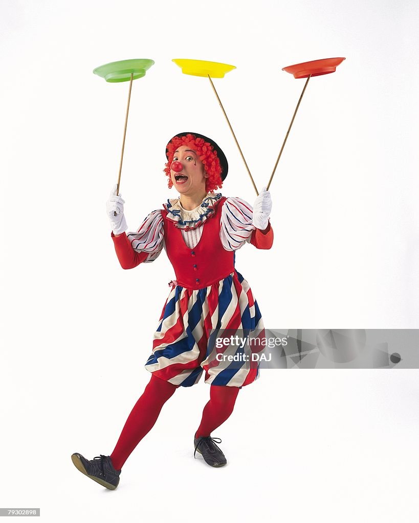 Portrait of Clown Spinning Plates, Front View