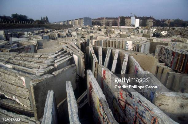 Graffiti-covered pieces of the wall are dismantled a year after the collapse of the Berlin Wall. Berlin had been politically divided since the end of...