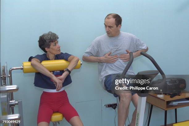 Claudie Andre-Deshays and Jean-Pierre Haignere in the weight-lifting room at the Sport's center.