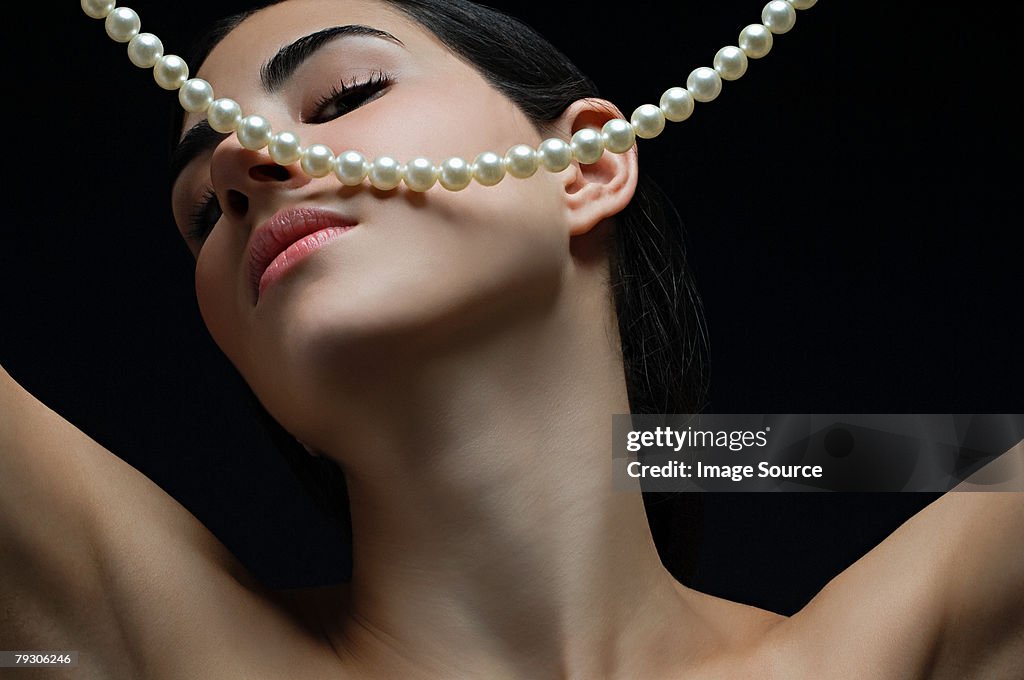 Woman with a pearl necklace