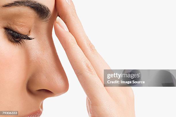 woman touching her face - human nose stockfoto's en -beelden