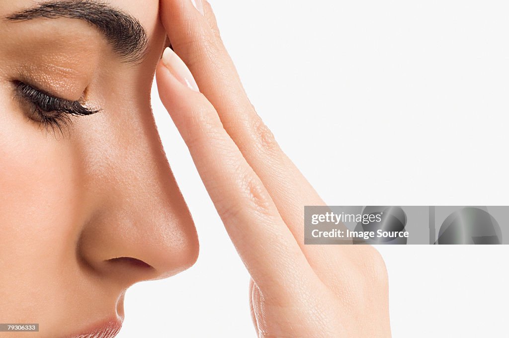 Woman touching her face