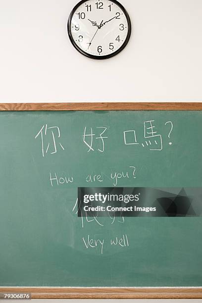 writing on a blackboard - mandarin chinese stock pictures, royalty-free photos & images
