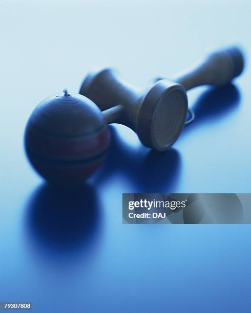 a cup and ball, close up, high angle view, toned image - kendama stock-fotos und bilder