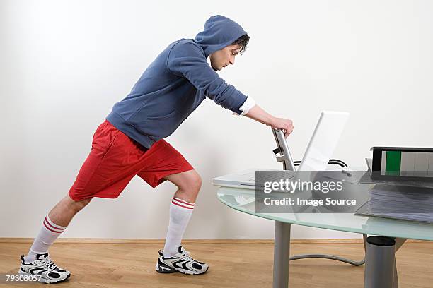 office worker warming up - running shorts stock pictures, royalty-free photos & images