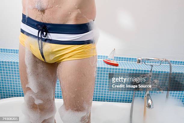 man standing in bathtub - male crotch stock pictures, royalty-free photos & images