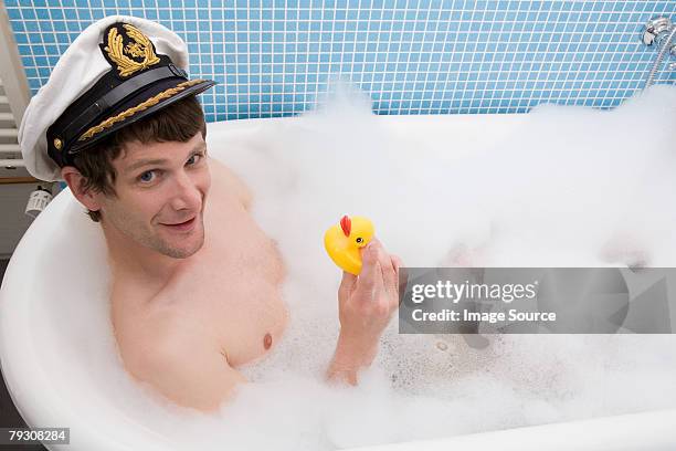 man in bath - rubber duck stock pictures, royalty-free photos & images