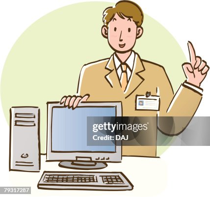 Businessman standing behind table with computer and explaining about computer, front view Businessman standing behind table with computer and explaining about computer, front view