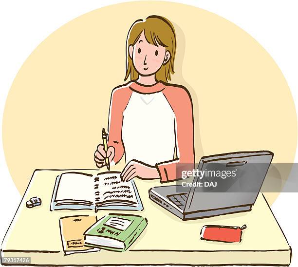 woman sitting at desk and writing down on notebook, front view - using laptop front view stock illustrations