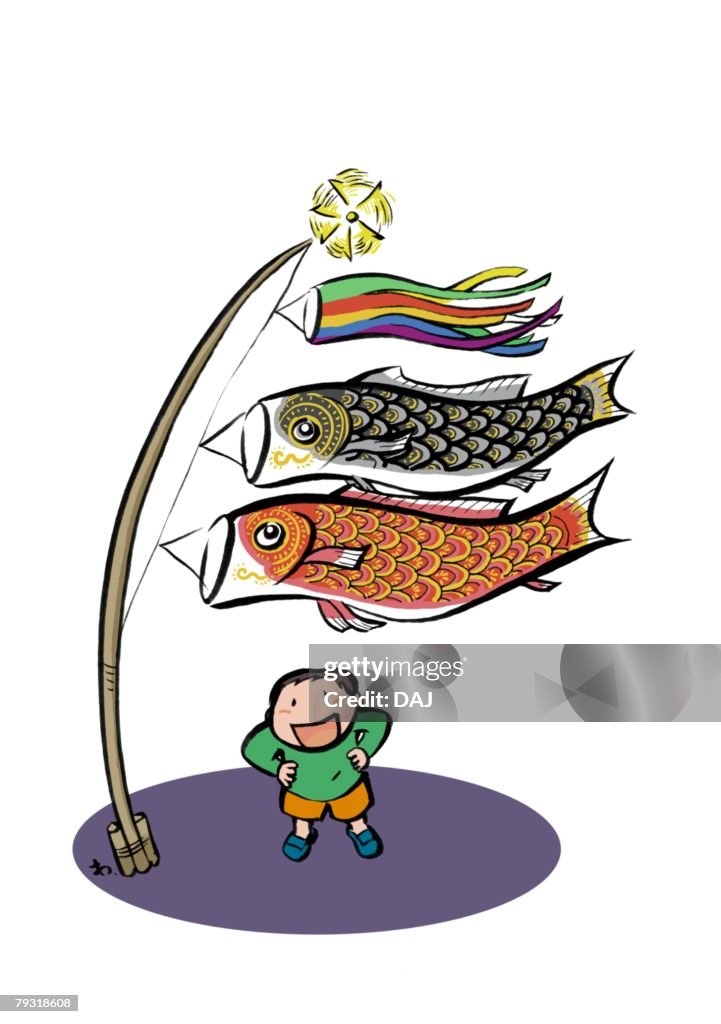 Elementary Age Boy Standing Under Koinobori