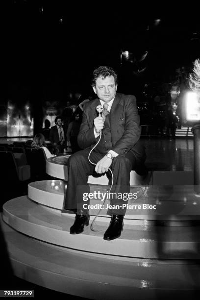 French journalist and television host Jacques Martin on the set of television show La Lorgnette.