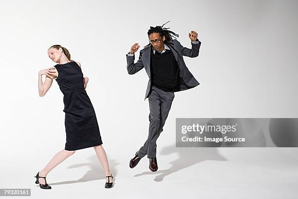 two office workers dancing - entertainment occupation stock pictures, royalty-free photos & images