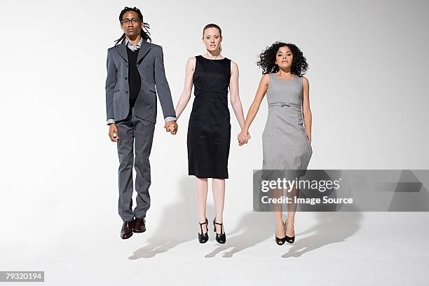 office workers jumping - three people on white stock pictures, royalty-free photos & images