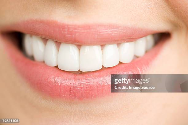 close up of a smiling woman - dental smile stock pictures, royalty-free photos & images