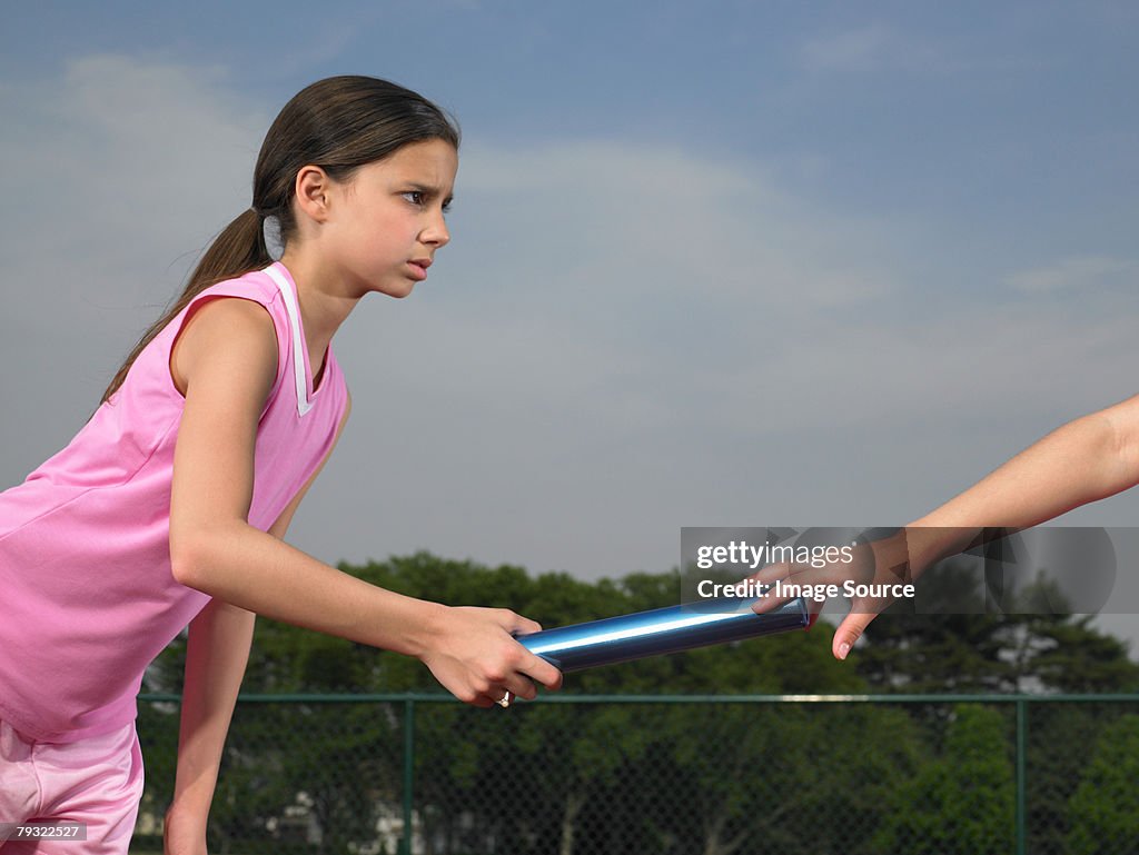 A girl passing the baton