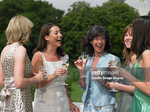 the bride and female wedding guests - wedding guest stock pictures, royalty-free photos & images