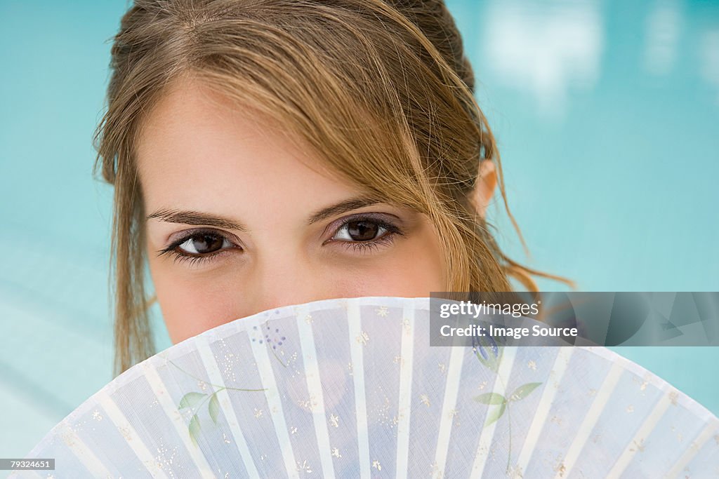 Young woman with fan