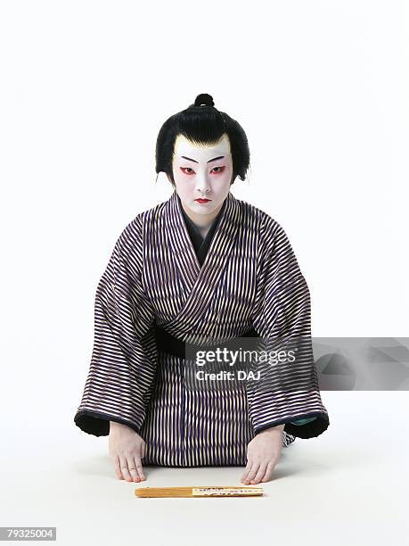 portrait of a kabuki actor sitting down and bowing, front view - actor bowing stock pictures, royalty-free photos & images