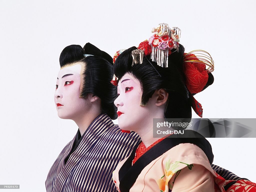 Portrait of two Kabuki actors, one acting as female, Side View