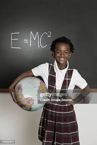 girl with a globe - primary school children in uniform stock pictures, royalty-free photos & images