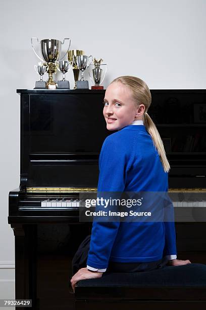 girl learning the piano - pianist portrait stock pictures, royalty-free photos & images