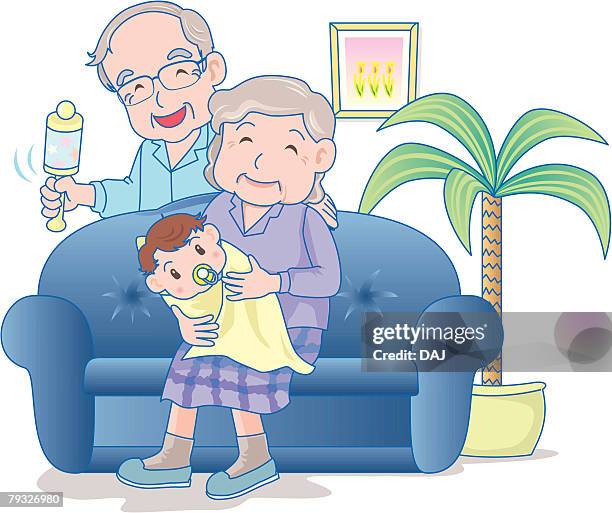 grandfather and grandmother with baby on sofa, smiling - enkel object stock-grafiken, -clipart, -cartoons und -symbole