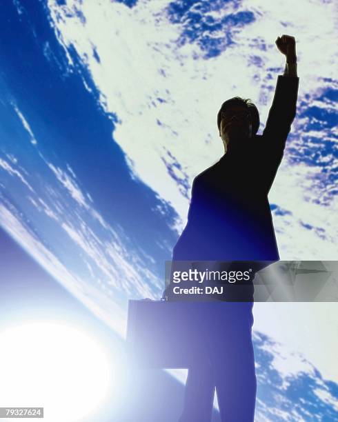 image of a businessman doing a guts pose outer space, cg, lens flare - portrait lens flare stock pictures, royalty-free photos & images