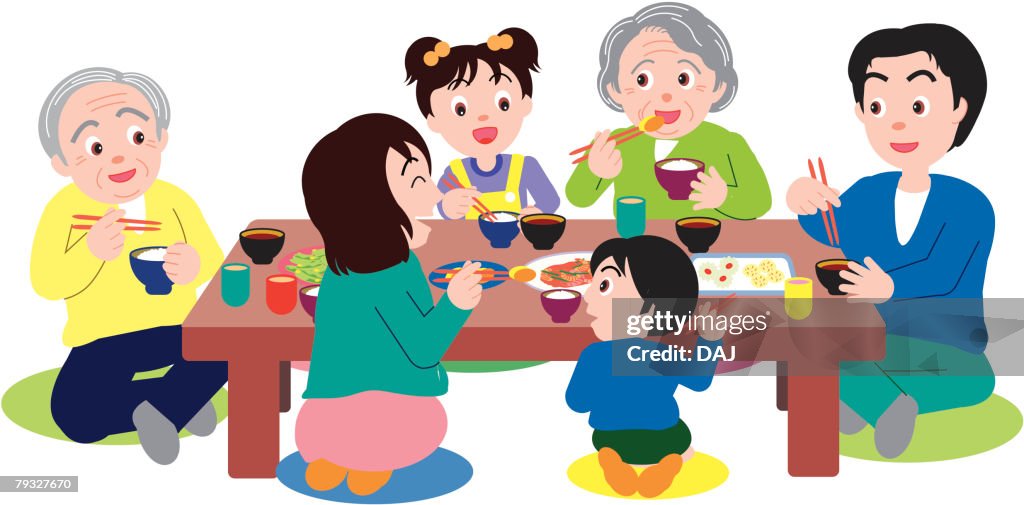 Three generation family eating and sitting at table