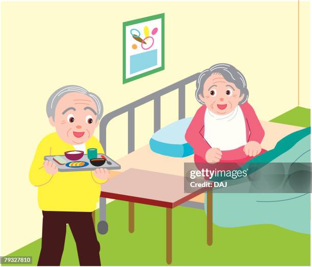 senior man bringing food for senior woman on bed in hospital - propped up pillow stock illustrations