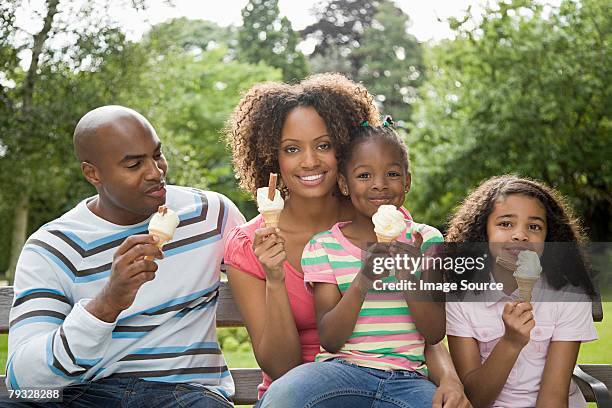 family in park with ice creams - ice cream family stock pictures, royalty-free photos & images