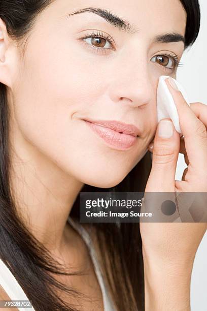 woman cleansing - woman applying cotton ball stock pictures, royalty-free photos & images