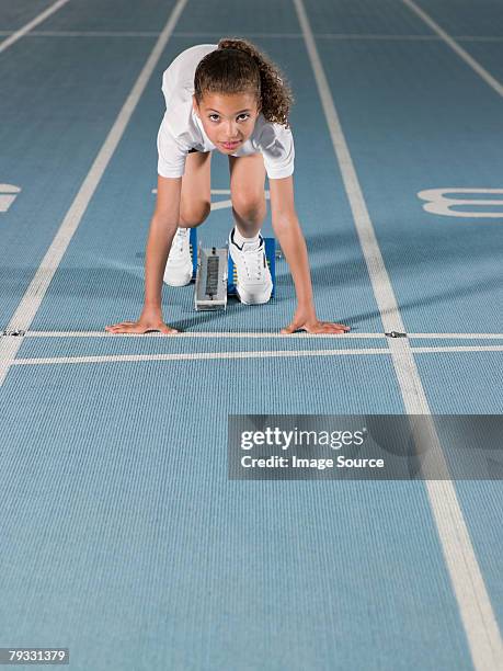 girl on starting line - track and field event stock pictures, royalty-free photos & images