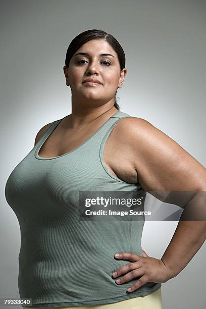 woman with hands on hips - fat hips stock pictures, royalty-free photos & images