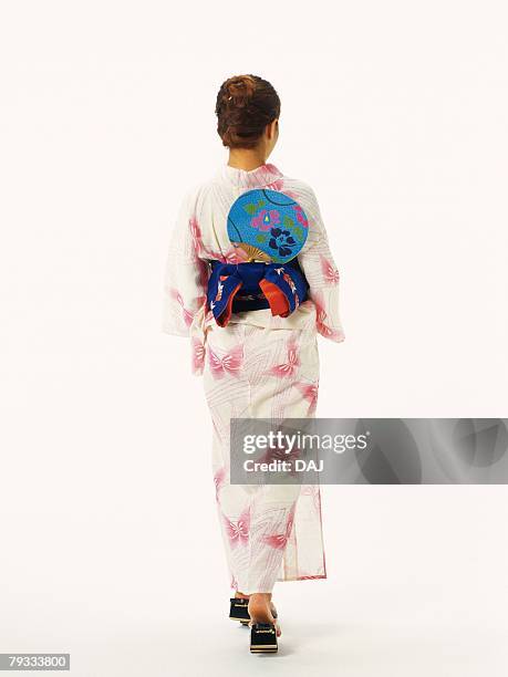 a woman in yukata, rear view - yukata stock-fotos und bilder