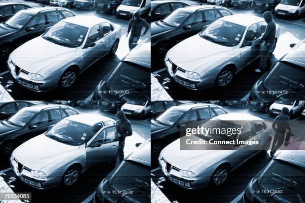 cctv footage of a thief stealing from a car - dief stockfoto's en -beelden