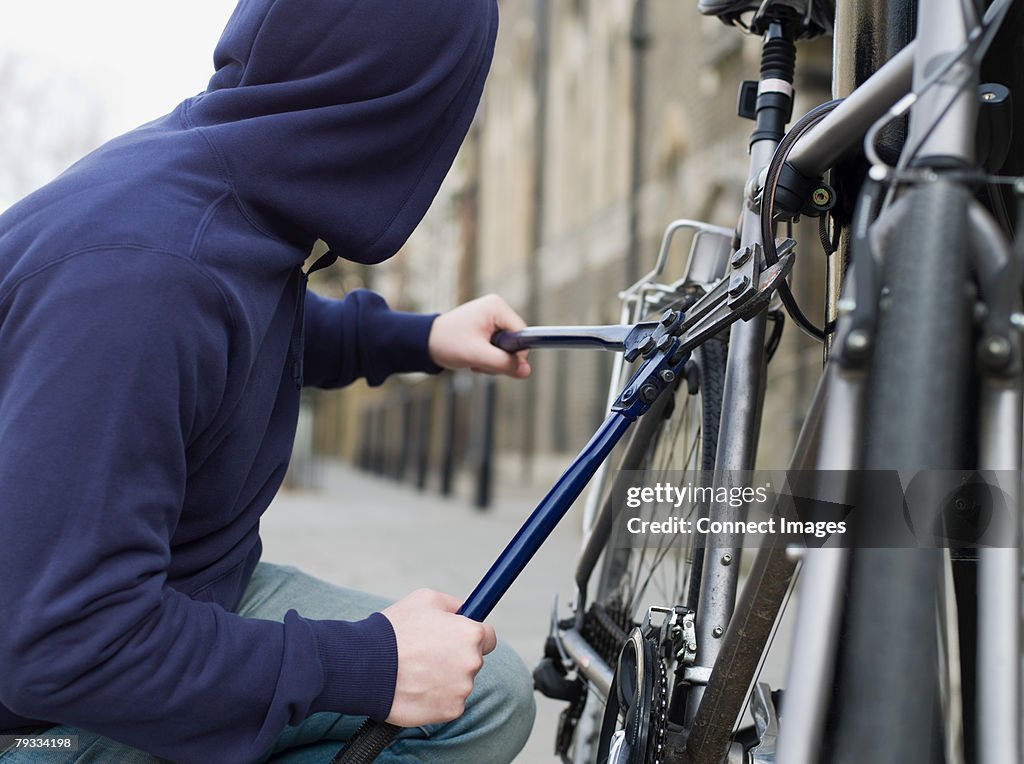 A thief stealing a bike
