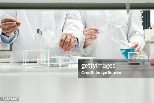 Scientists conducting an experiment Scientists conducting an experiment